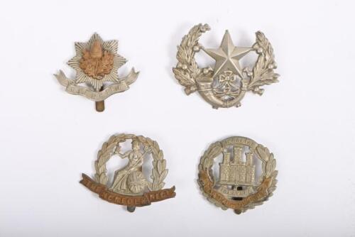 MILITARY CAP BADGES: Four various United Kingdom cap badges. Norfolk Regt, Cheshire Regt badges