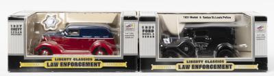 LAW ENFOREMENT: Two Limited Edition 1:24 scale LIBERTY CLASSICS LAW ENFORCEMENT models. 1931 FORD MODEL A SEDAN in black & 1937 CHEVY SEDAN DELIVERY in blue/red CITY OF CLEVELAND livery