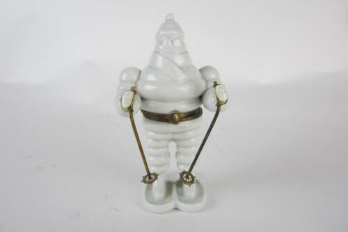 MICHELIN: A novelty hinged French porcelain skiing Bibendum figure