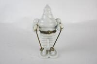 MICHELIN: A novelty hinged French porcelain skiing Bibendum figure