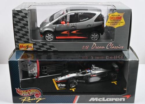 McLAREN-MERCEDES: Two scale models with a McLaren-Mercedes F1 theme. 1:18 scale Mercedes-Benz A-Class (Formula 1 Design) by Maisto as driven by David Coulthard & 1:24 scale Hot Wheels pit diorama McLaren-Mercedes MP4-13 as driven by Mika Hakkinen. Limited