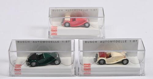 MG MIDGET TC CABRIO: Three BUSCH 1:87&nbsp;scale MG Midget TC Cabrio (45907) in the colours of British Racing Green, cream, red