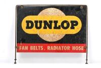An early metal point of sale Dunlop advertising sign with surround mounting bracket, sign 23cm high x 45cm wide