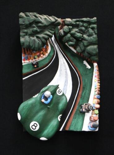 A wonderful 3D mixed media hanging artwork featuring a Jaguar D-Type at Le Mans, stretched canvas with applied styrofoam, 91cm high, 60cm wide, 23cm deep. By automotive artist Terry Lawrie