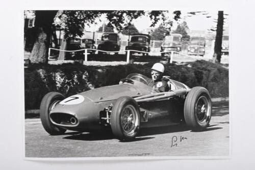 MOSS: A reproduced black and white picture depicting Stirling Moss racing a Maserati 250F at Albert Park, 1956. Stirling Moss signature