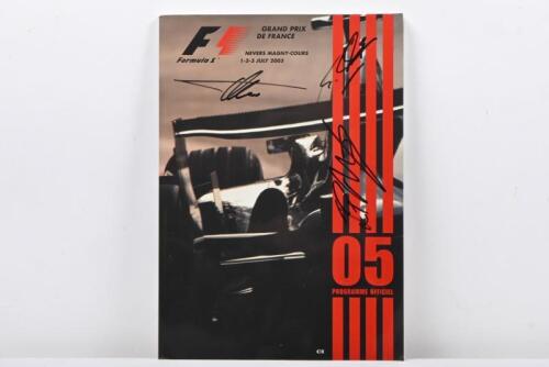 FRENCH GRAND PRIX: A July 2005 'GRAND PRIX DE FRANCE' Official Programme. Front cover of programme signed by Fernando Alonso, Michael Schumacher & Juan Pablo Montoya