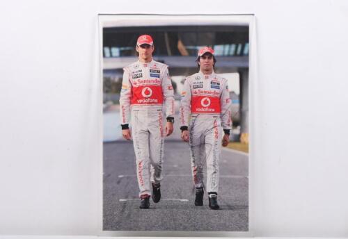 McLAREN-MERCEDES: A circa 2013 colour picture of McLaren-Mercedes team drivers Jenson Button and Sergio Perez. Button and Perez signatures