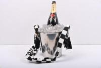 HANDBAG: A novel hand bag in the shape of a champagne bottle on ice with ice bucket by automotive artist Terry Lawrie