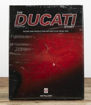 DUCATI: A sealed copy of 'THE DUCATI STORY - SIXTH EDITION' hardcover book by Ian Falloon