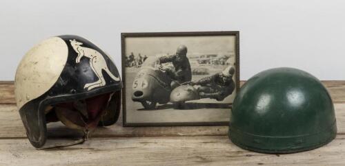 HELMETS: Jack Craigs'&nbsp;early plum pudding green helmet and a later Stadium Ltd fibreglass&nbsp;helmet bearing a kangaroo, together with an early photo