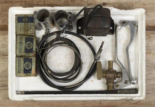 MIXED GROUP: A mixed group containing cables, twin leader throttle cable, brake/clutch levers, front wheel bears, brass tap, couplings and Lucas regulator