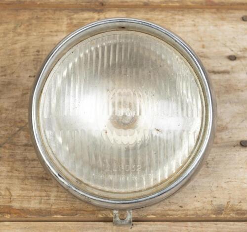 BULTACO: A glass headlamp reverse branded '12.21.032 Bultaco, made in Spain and surround, glass 13cm diameter