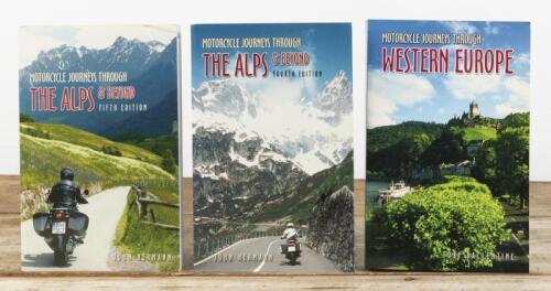MOTORCYCLE JOURNEYS: Three softcover books detailing motorcycle journey's. 'MOTORCYCLE JOURNEYS THROUGH WESTERN EUROPE' by Toby Ballentine & two editions of 'MOTORCYCLE JOURNEYS THROUGH THE ALPS & BEYOND' by John Hermann