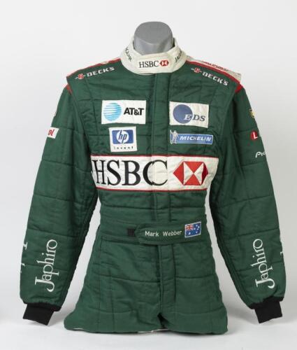 WEBBER: An original, circa 2003, OMP (MOD: IA01804 EN 340) Mark Webber worn race suit in Jaguar F1, HSBC livery. Mark Webber signature