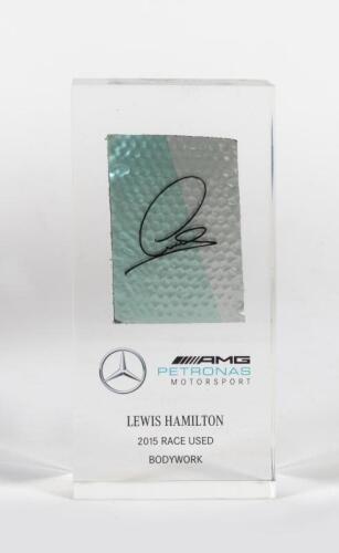 HAMILTON: A LEWIS HAMILTON 2015 RACE USED BODYWORK desk piece from the MGP-W06. Part of the Mercedes-AMG Petronas Motorsport collection