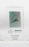 HAMILTON: A LEWIS HAMILTON 2015 RACE USED BODYWORK desk piece from the MGP-W06. Part of the Mercedes-AMG Petronas Motorsport collection