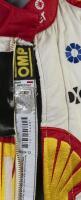 SLADE: A OMP racing suit as worn by Tim Slade during the 2020 Virgin Australia Supercars Championship for DJR Team Penske, Shell V-Power Racing Team. Suit signed by Dick Johnson to front. CoA - 4