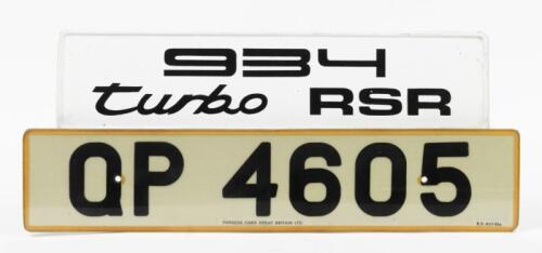 NUMBER PLATES: Two Porsche related number plates including '934 Turbo RSR' white display number plate and UK 'QP 4605' registration plate with 'Porsche Cars Great Britain LTD dealer sticker to bottom of plate.