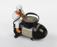 MICHELIN: A small 110 volt Bibendum figured compressor, French circa 1928