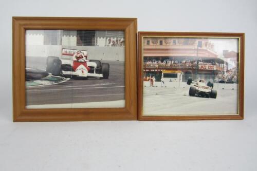GRAND PRIX: Two framed Formula 1 car photographs.