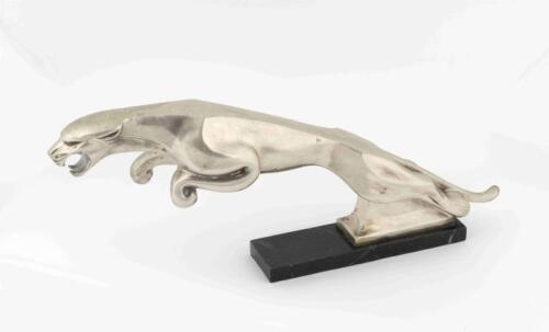 BRYSON'S: A circa 1960s metal showroom figure of a leaping jaguar, mounted on granite base with affixed label &lsquo;Property of Bryson Ind. Ltd&rsquo;, 23cm high, 57cm wide [Location: Melbourne]
