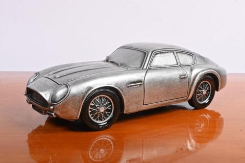 ASTON: A modern solid resin model of a Aston Martin DB4 Zagato, 22cm long
