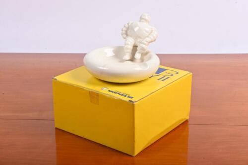 MICHELIN: A modern ceramic change tray with seated Bibendum to edge,