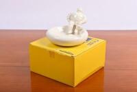 MICHELIN: A modern ceramic change tray with seated Bibendum to edge,