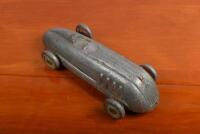 LANDSPEED: A circa 1920s/1930s 'Stokes Toys' aluminum pull land speed record style car, 27cm long - 3