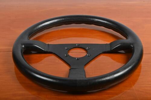 MOMO: A circa 1970s/1980s black leather Momo steering wheel, 35cm diameter (Updated Images)