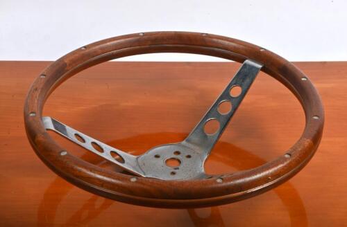 STEERING WHEEL: A timber rimmed deep dished steering wheel, 34cm diameter