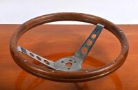 STEERING WHEEL: A timber rimmed deep dished steering wheel, 34cm diameter