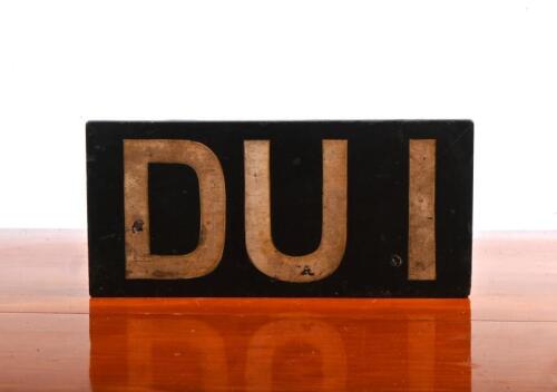DUI: A wooden English 'DUI' number plate