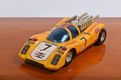 TIN TOY: A TAIYO tin Big Machine #7 CHAMPION GT Mystery Bump 'n' Go car