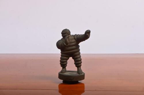 MICHELIN MAN: A circa 1980s bronze Michelin Man radiator mascot; measures 10.5cm in height.