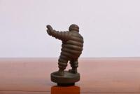MICHELIN MAN: A circa 1980s bronze Michelin Man radiator mascot; measures 10.5cm in height. - 2