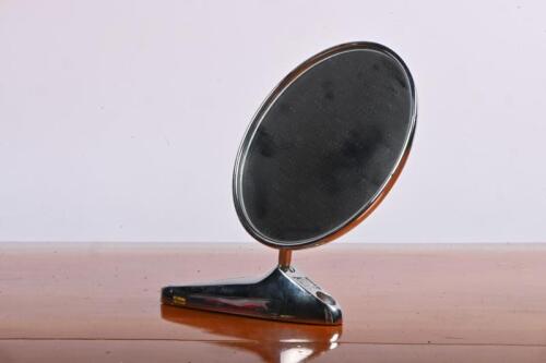 SIDE VIEW MIRROR: A chrome round side view mirror