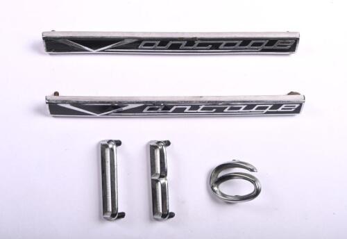 ASTON MARTIN: A small group of Aston Martin badges. Two 'Vantage' & 'DB6 badges
