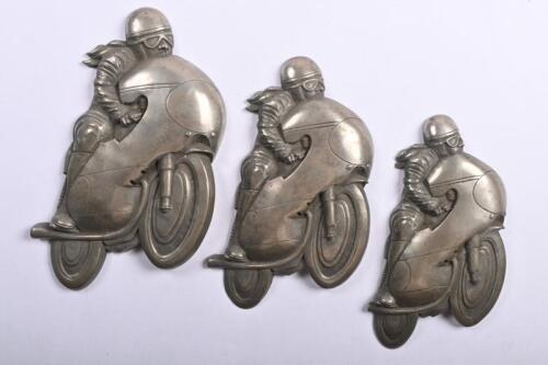 MOTORCYCLES: A wall mounted pewter three piece set featuring vintage motorcycles in a state of speed