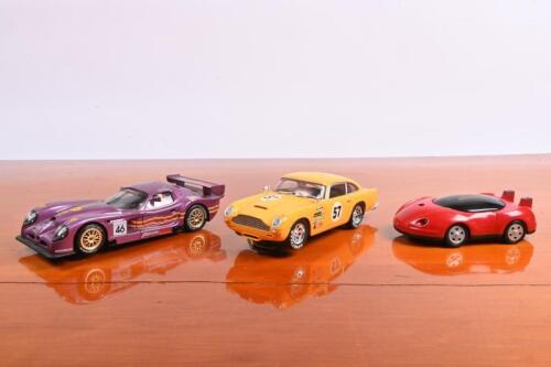 SLOT CARS: Two slot cars. Carrera EVOLUTION Aston Martin DB5 & FLY PANOZ GT