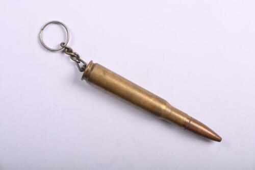 BULLET: A used brass large calibre bullet