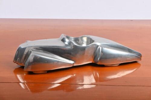 SPORTS CAR: A decorative&nbsp;cast metal model of a stylised&nbsp;touring car, overall length of 21cm,
