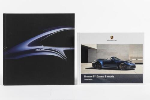 911: Two publications by Porsche. '911. Timeless Machine.' hardcover book by Dr.Ing.h.c.F. Porsche AG & 2018 911 Carrera brochure
