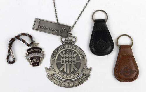 INTERNATIONAL EVENTS: A group of four key rings and medallions for international events. 'AUTOMOBILE CLUB MONACO DRIVER'S CLUB 2010' metal medallion with attached CREDIT SUISSE&nbsp;tag numbered '0699'