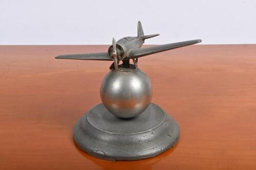 DESK PIECE: A Art-Deco pewter desk piece in the form of a propeller aircraft