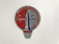 EMPIRE STATE: An aluminium 'Empire State' country badge, inscripted with 'World's Most Famous Building - New York'&nbsp;