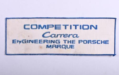 PORSCHE: A genuine Porsche 'COMPETITION Carrera ENGINEERING THE PORSCHE MARQUE' cloth badge. Badge measures 33cm wide, 11.5cm high overall