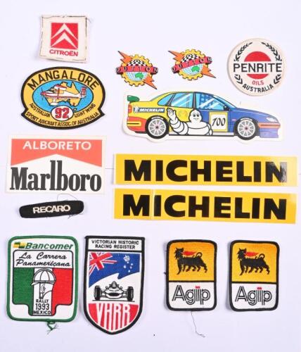 BADGES/ADHESIVES: A group of motoring and motor racing cloth badges and adhesives. 'BANCOMER - La Carrera Panamericana, RALLY 1993 MEXICO', 'VICTORIAN HISTORIC RACING REGISTER - VHRR' embroidered cloth badge. MICHELIN stickers