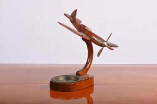 DESK PIECE: A wooden desk piece in the form of a World War II fighter aircraft