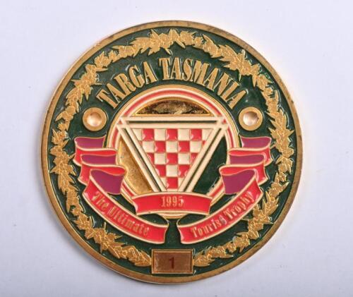 TARGA TASMANIA: A brass '1995 TARGA TASMANIA - The Ultimate Tourist Trophy' badge. Numbered '1'
